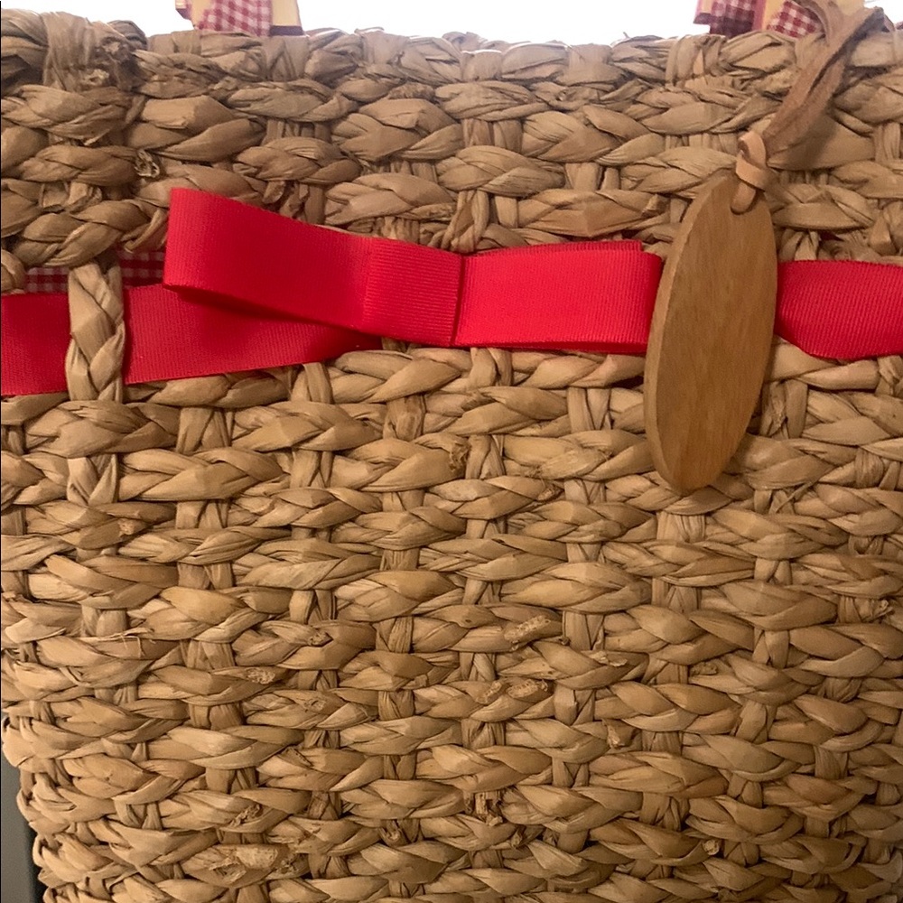 Red and Tan Woven Tote with Earthy Accents
It’s brand new